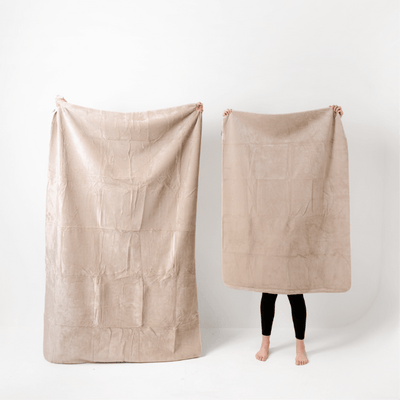 Two persons holding different-sized of freaksheet, small and large