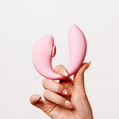 Hand Holding A Tiff Dual Pleasure Vibrator