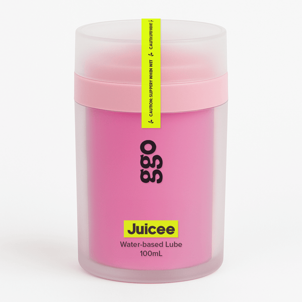 Pink container of Juicee water-based lubricant with a yellow label on a white background