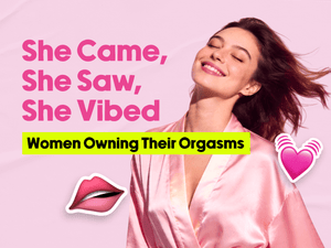 A woman in a pink robe and a text 'She Came, She Saw, She Vibed: Women Owning Their Orgasms' on a pink background  with lip and heart icons. 