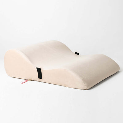 Side view of Bumpy Cuddles intimacy pillow in beige by Girls Get Off – ergonomic sex pillow designed to make sex feel more pleasurable by angling the pelvis in a way that allows for direct and constant G-spot stimulation.