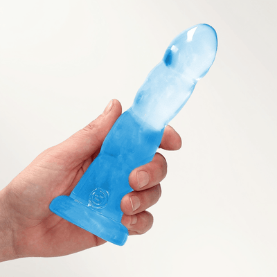 REALROCK 7 Inch Suction Cup Dildo in translucent blue, held in a hand showing suction base